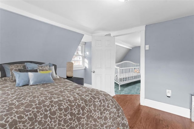 bedroom with dark wood-type flooring