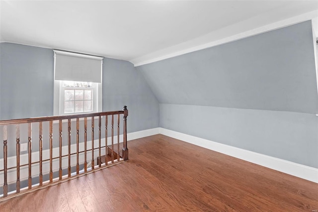 bonus room featuring hardwood / wood-style flooring and lofted ceiling