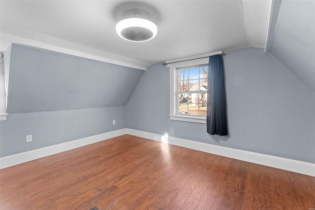 bonus room featuring lofted ceiling and wood-type flooring