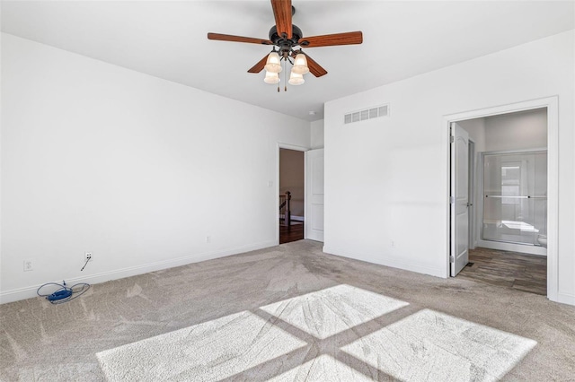 unfurnished bedroom featuring ceiling fan, connected bathroom, and carpet flooring