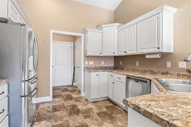 kitchen featuring white cabinets, appliances with stainless steel finishes, and sink