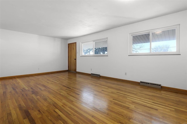 unfurnished room featuring hardwood / wood-style floors