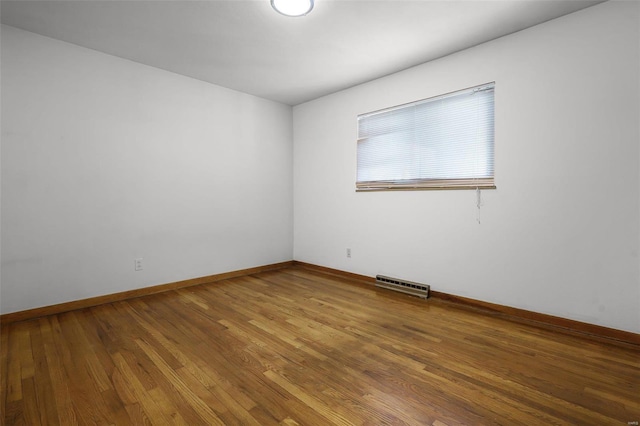 empty room featuring hardwood / wood-style flooring