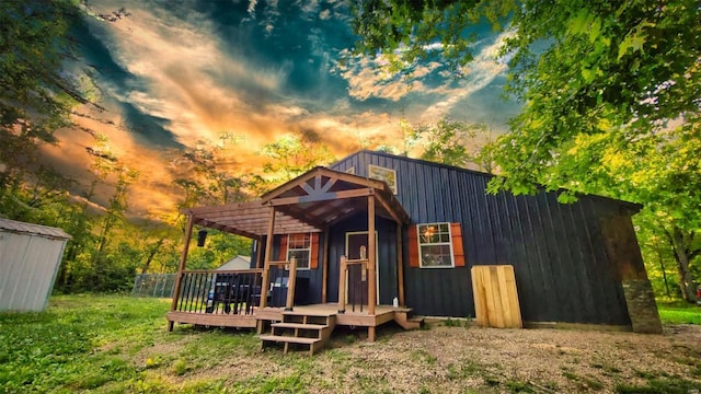 outdoor structure at dusk with a lawn