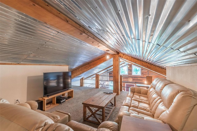 carpeted living room featuring wooden walls