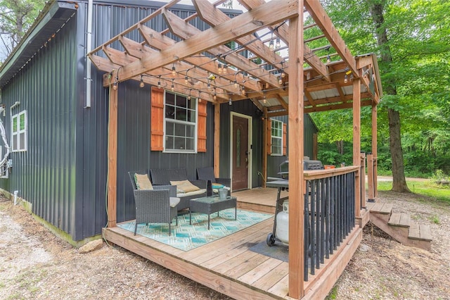 deck with an outdoor hangout area and a pergola