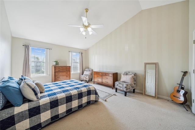 bedroom with ceiling fan, light carpet, and lofted ceiling