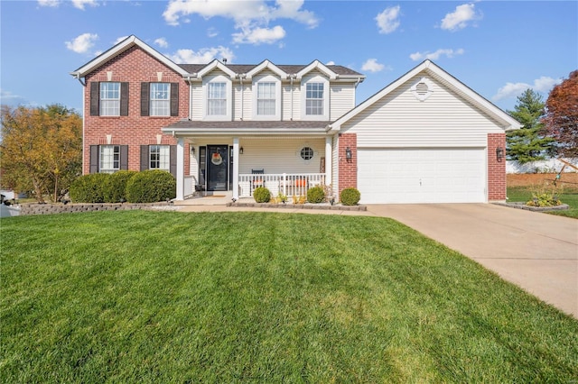 view of front of property featuring a garage, a front yard, and a porch