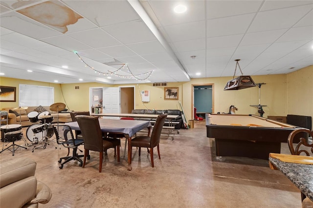 recreation room featuring pool table, a paneled ceiling, and concrete floors