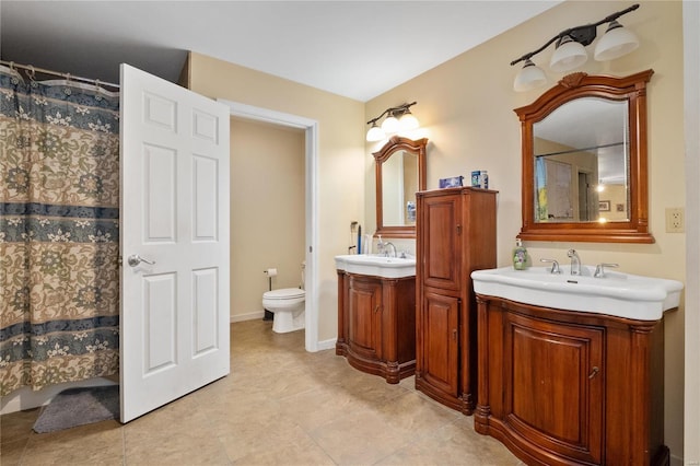 bathroom featuring vanity, walk in shower, and toilet