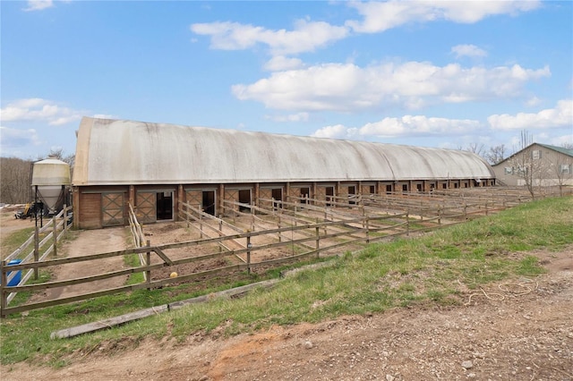 view of stable featuring a rural view