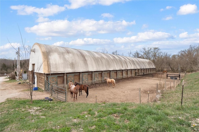 view of stable featuring a rural view