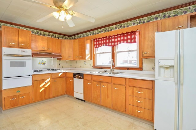 kitchen with sink, backsplash, white appliances, and ceiling fan