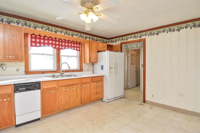 kitchen featuring ceiling fan, sink, white appliances, and crown molding