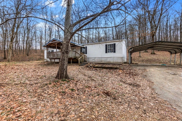 view of front of home with a carport