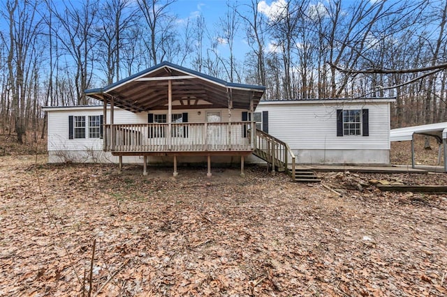 back of house with a wooden deck