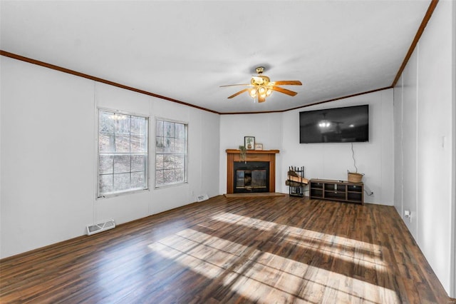 unfurnished living room featuring hardwood / wood-style flooring, ornamental molding, and ceiling fan