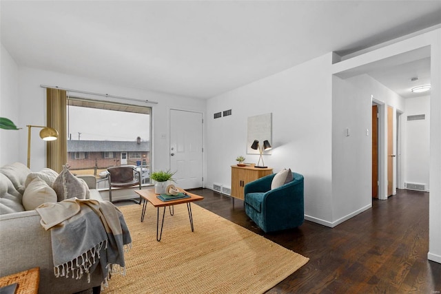 living room featuring dark wood-type flooring