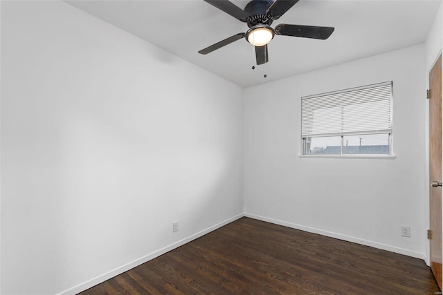 empty room with dark wood-type flooring and ceiling fan