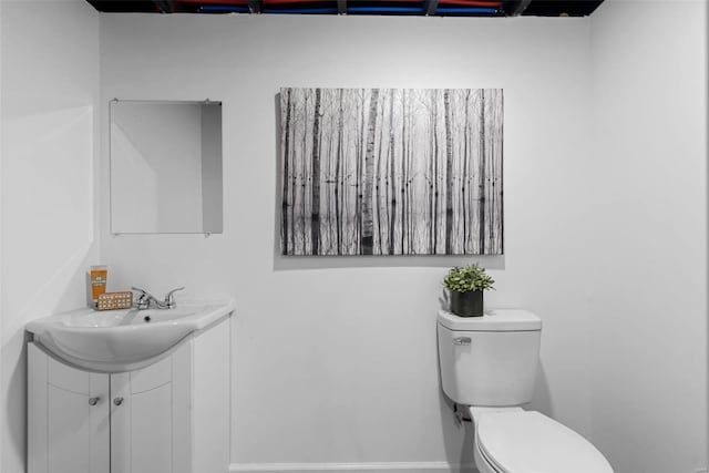 bathroom featuring toilet and sink