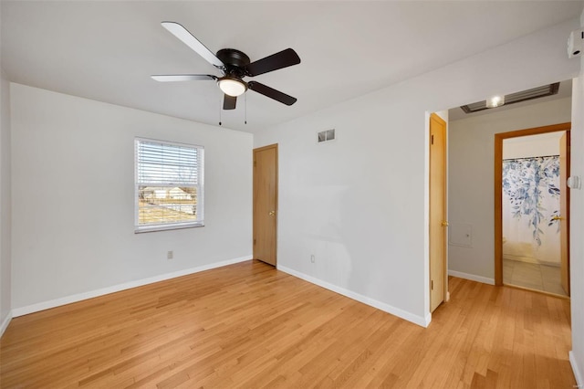 empty room with light hardwood / wood-style floors and ceiling fan