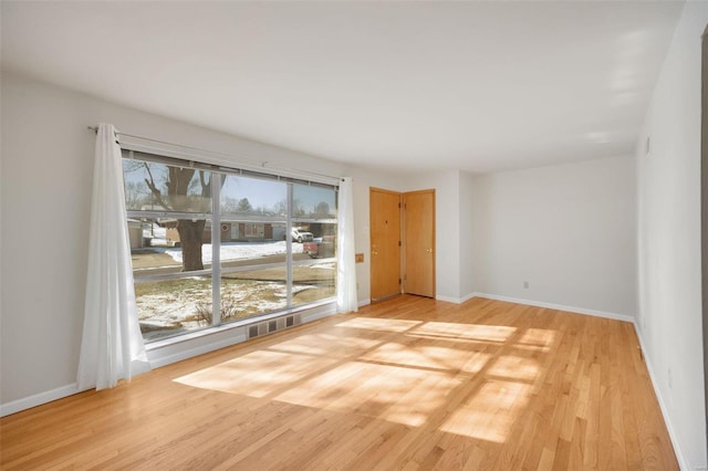 unfurnished room featuring light wood-type flooring