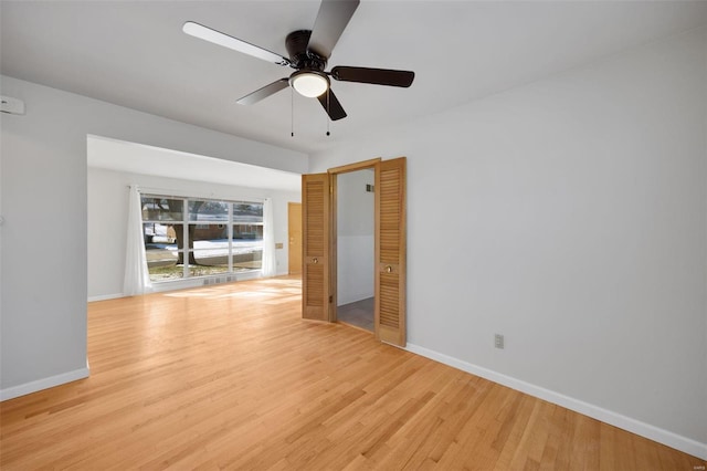 unfurnished room with ceiling fan and light hardwood / wood-style flooring