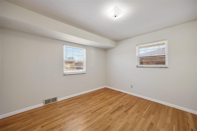 spare room with light wood-type flooring