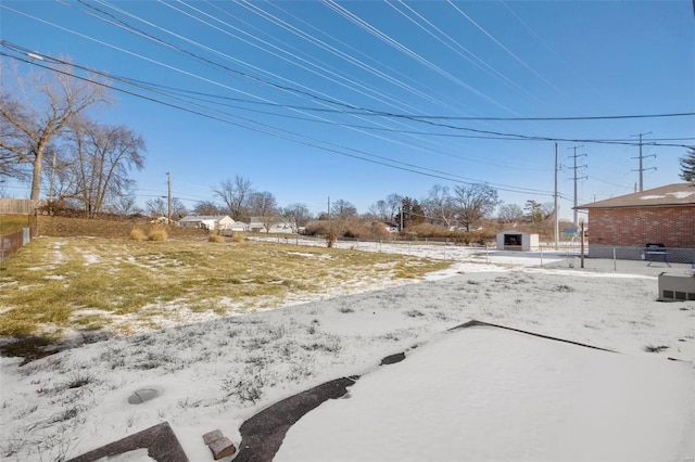 view of yard layered in snow