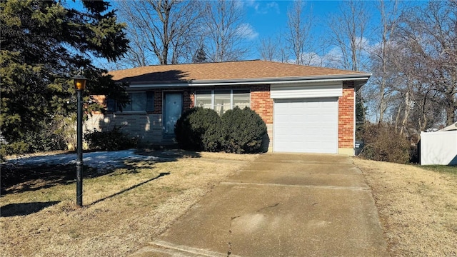 single story home with a garage and a front yard