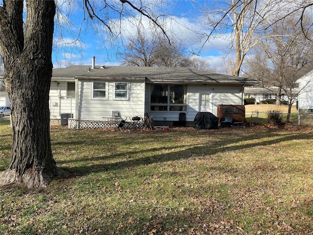 back of house with a yard