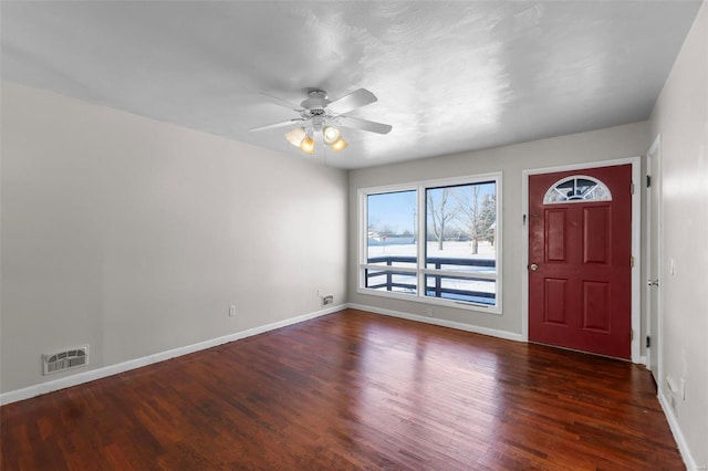 foyer featuring ceiling fan and dark wood-type flooring