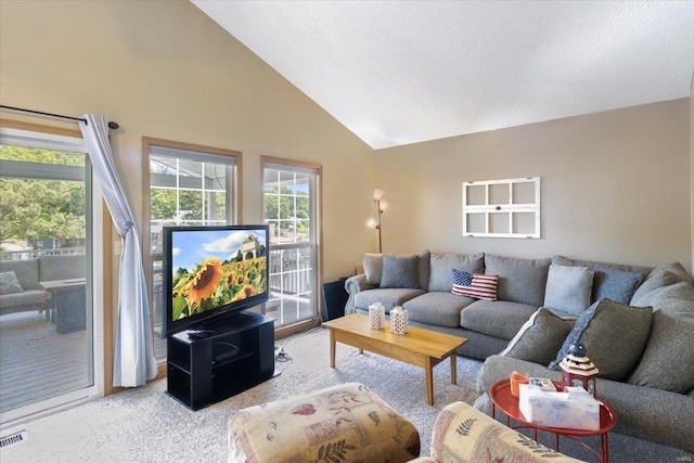 living room featuring light colored carpet and high vaulted ceiling