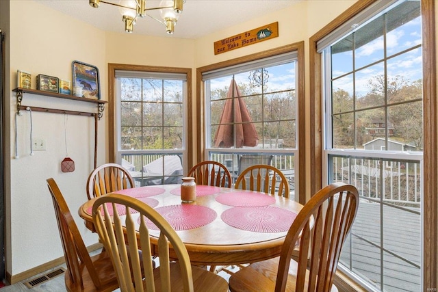 dining area featuring a chandelier