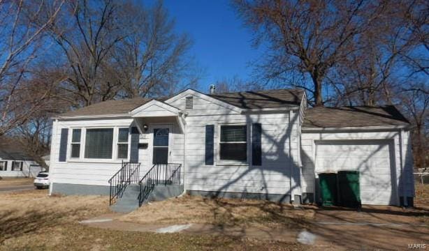 bungalow-style home featuring an attached garage