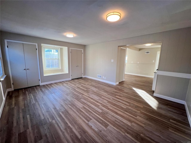 interior space with dark hardwood / wood-style flooring