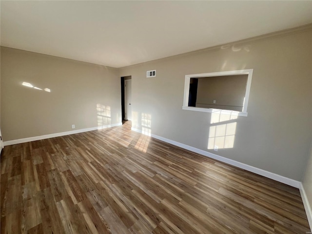 unfurnished room featuring dark wood-type flooring