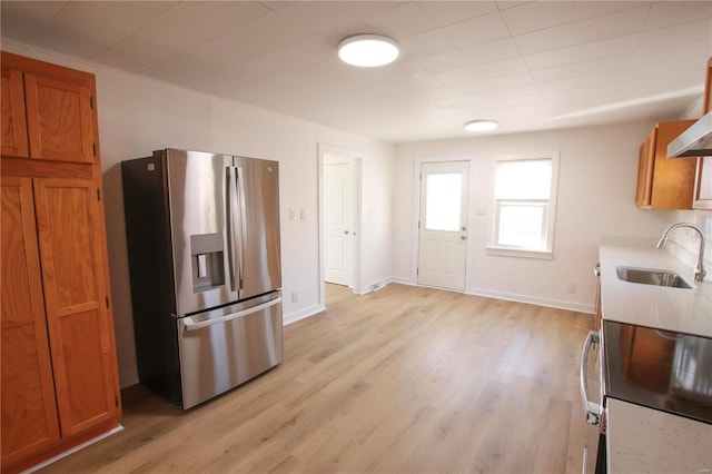 kitchen featuring light hardwood / wood-style floors, sink, and stainless steel appliances