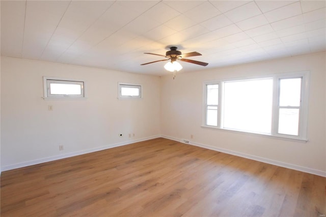 empty room featuring hardwood / wood-style floors and ceiling fan