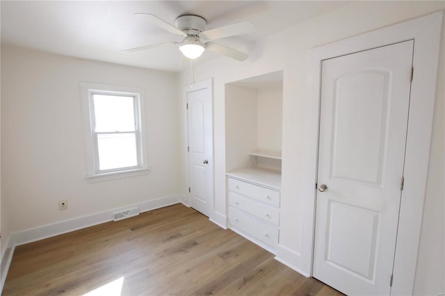 unfurnished bedroom featuring ceiling fan and light hardwood / wood-style floors