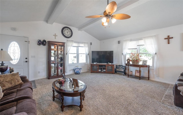 carpeted living room featuring ceiling fan and lofted ceiling with beams