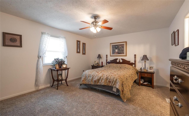 carpeted bedroom with a textured ceiling and ceiling fan