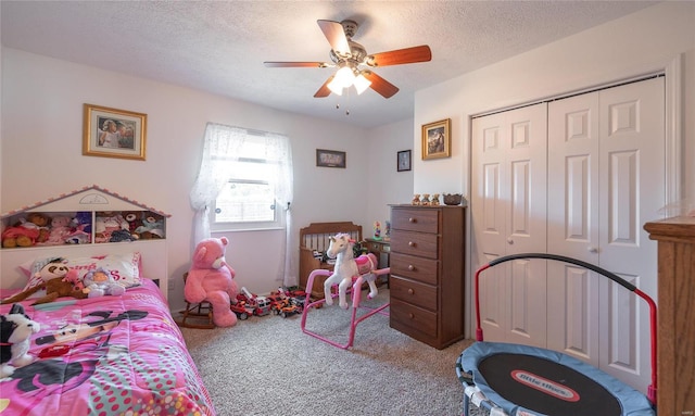 bedroom with carpet, a textured ceiling, a closet, and ceiling fan