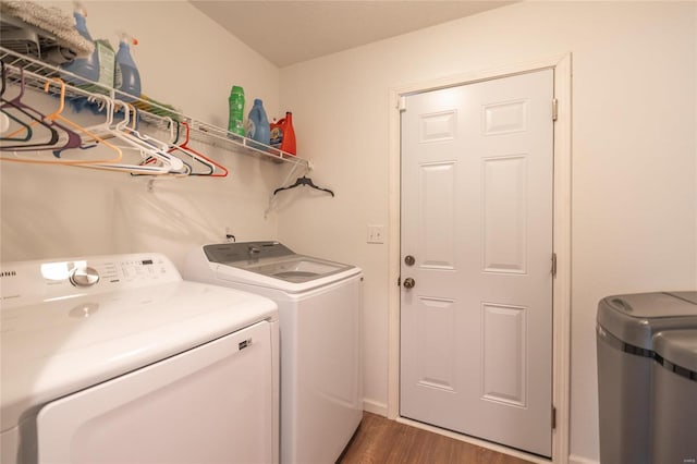 washroom featuring dark hardwood / wood-style flooring and washer and dryer