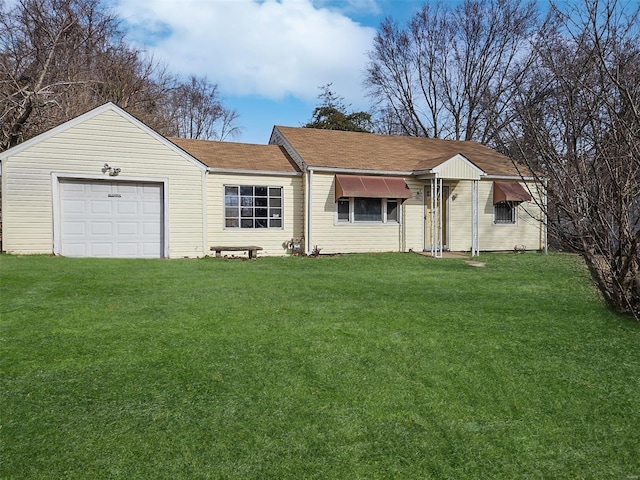 ranch-style house featuring a garage and a front yard