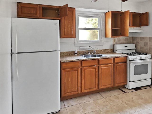kitchen with light tile patterned flooring, sink, tasteful backsplash, ceiling fan, and white appliances