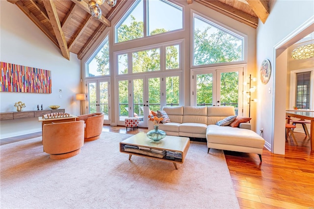 living room with french doors, wood-type flooring, high vaulted ceiling, wooden ceiling, and beam ceiling