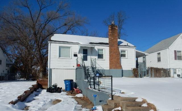 view of snow covered property