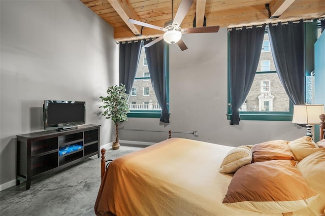 carpeted bedroom featuring ceiling fan, beam ceiling, and wooden ceiling