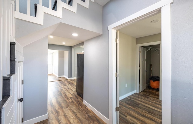 corridor featuring dark hardwood / wood-style floors